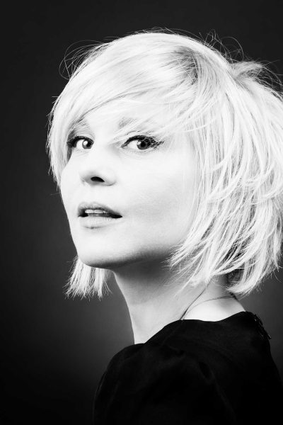 close-up-portrait-beautiful-woman-against-black-background_110386843