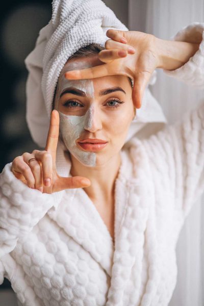 portrait-woman-with-facial-mask-half-face